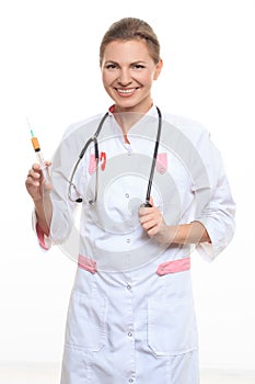 Young female doctor holding a syringe