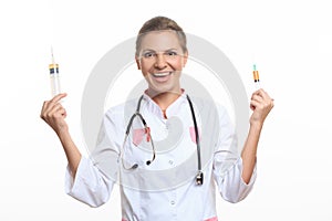 Young female doctor holding a syringe