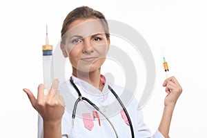 Young female doctor holding a syringe