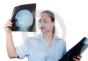 Young female doctor looking at x-ray picture