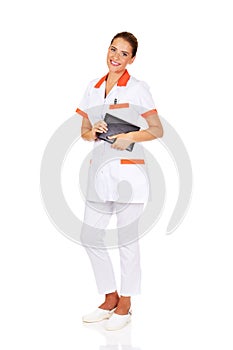 Young female doctor or nurse holding black notes