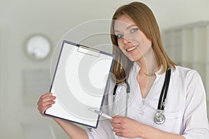 Young female doctor posing in the office