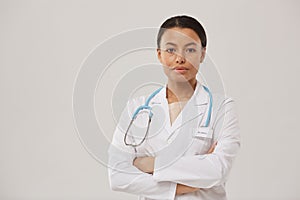 Young Female Doctor Posing on White