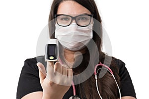 Young female doctor with a puls oxymeter, isolated on white background