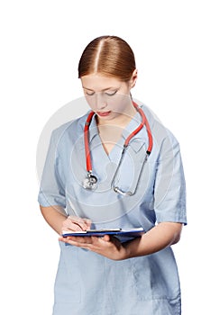 Young female doctor with red stethoscope and paper holder completing documents