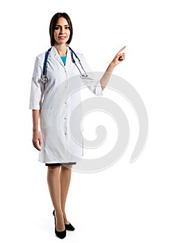 Young female doctor shows on a white background