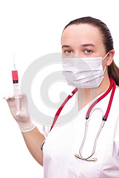 Young female doctor with syringe wearing a mask