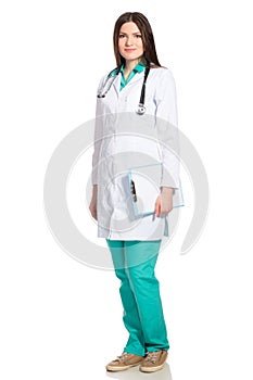 Young female doctor in white robe with clipboard and stethoscope