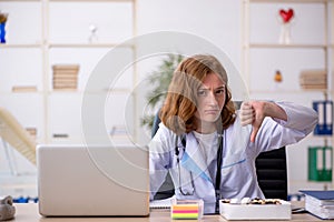 Young female doctor workiing in the clinic