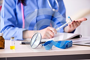 The young female doctor working in the clinic