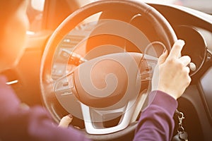 Young Female Driving Car on Highway in Country During summer. Backseat View