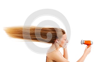 Young female drying hair , isolated on white.