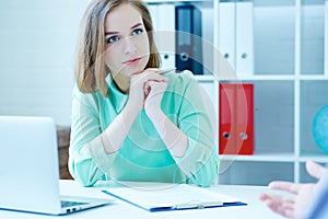 Young female employee of the staffing agency listening attentively the male job seeker.