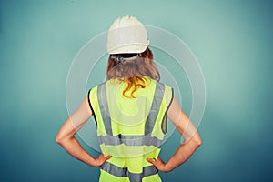 Young female engineer in high vis and hardhat