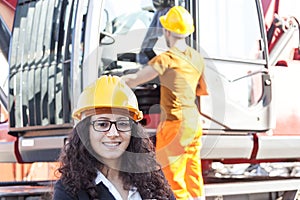Young female engineer posing in junkyard