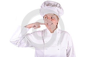 Young female executive chef point her cheek