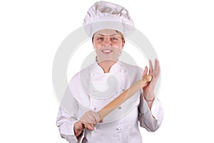 Young female executive chef with a rolling pin