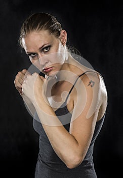 Young Female Fighter Looking Fierce at the Camera