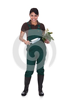 Young female gardner with gardening tools
