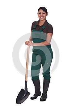 Young female gardner with shovel