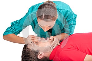 Young female giving patient CPR.