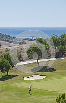 Young female golf player at Costa del Sol resort, Spain