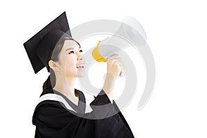 Young female Graduation Shouting With Megaphone
