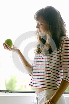 Young Female with Green Apple