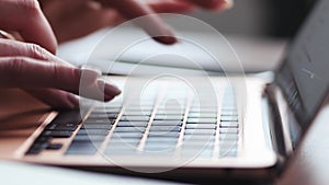 Young female hands texting on laptop keyboard close up. Busy business woman emailing to client remotely use digital