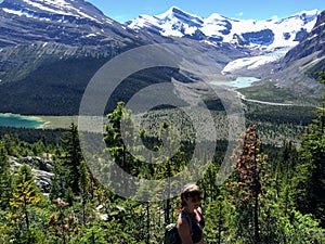 A young female hiker hiking along the Berg Lake Trail, in Mount Robson Provincial Park
