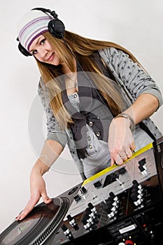 Young female hip-hop dj playing