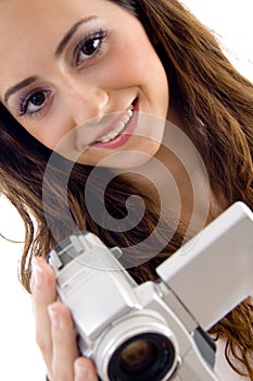 Young female holding handy cam