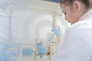 Young female Laboratory scientist working at lab with test tubes