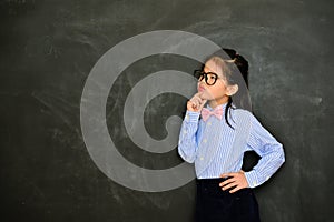 Young female little teacher looking at empty area