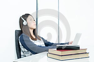 Young female long hair sitting in living room and learning online