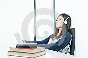 Young female long hair sitting in living room and learning online