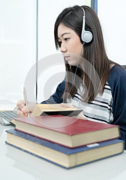 Young female long hair sitting in living room and learning online