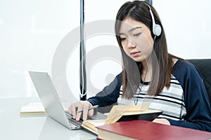 Young female long hair sitting in living room and learning online