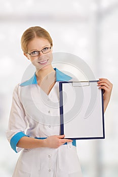 young female medical doctor with clipboard