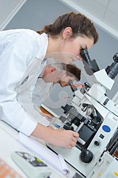 young female medical technician working in laboratory
