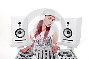 Young Female Mixing Music Using DJ Mixer