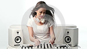 Young Female Mixing Music Using DJ Mixer