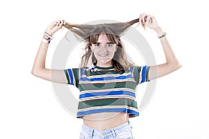 Young female model touching clean curly hair after hygiene treatment