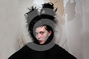 Woman with black swan feathers in hair