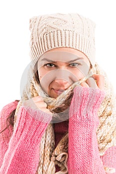 Young female model wearing warm knitted scarf and hat