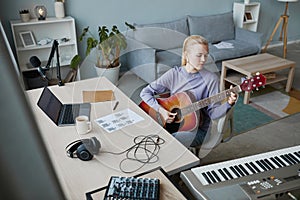 Young Female Musician at Home