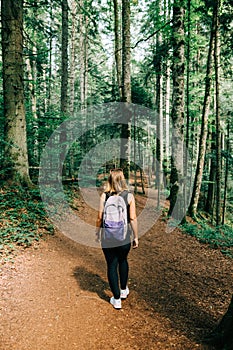 Young female nature explorer in the forest