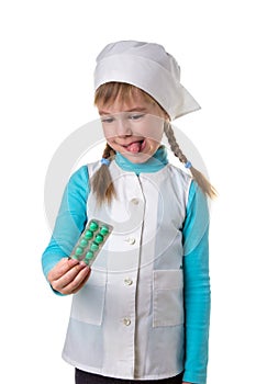 Young female nurse wearing medical uniform disgusted expression, emotion, holding blister of pills in the right hand