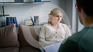 Young female patient talking to the doctor at the psychological session