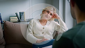 Young female patient talking to the doctor at the psychological session in the office